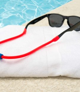 Flotez eyeglass strap on sunglasses at the pool